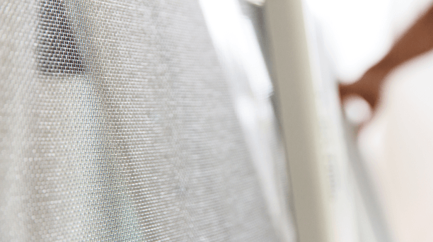 Close-up of Tai-fun fiberglass fabric being inspected by hand